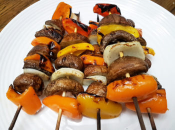 Grilled baby portobello mushroom skewer