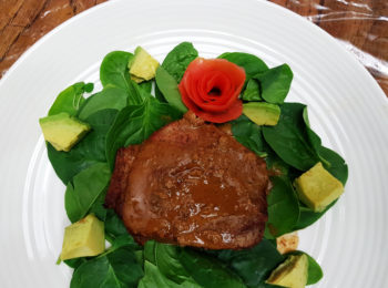 steak on a bed of spinach